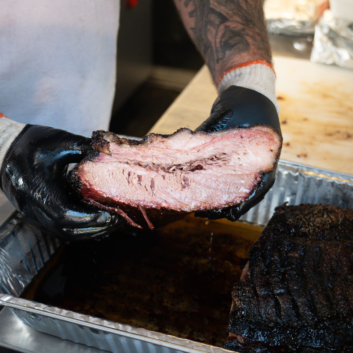Thick-cut slice of smoked prime brisket, straight off the pit