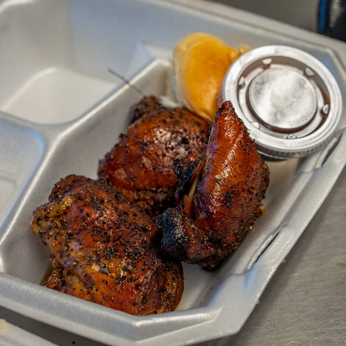 Smoked BBQ chicken packed to go